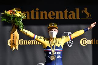 ORCIERES FRANCE SEPTEMBER 01 Podium Primoz Roglic of Slovenia and Team Jumbo Visma Celebration Medal Flowers Mask Covid safety measures during the 107th Tour de France 2020 Stage 4 a 1605km stage from Sisteron to OrcieresMerlette 1825m TDF2020 LeTour on September 01 2020 in Orcieres France Photo by AnneChristine Poujoulat PoolGetty Images