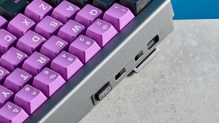 A black and purple Epomaker EK68 wireless mechanical keyboard