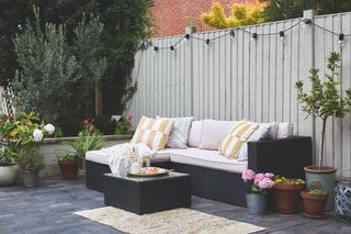 grey wooden fence around a modern seating area