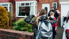 People going into a house © Getty Images/iStockphoto