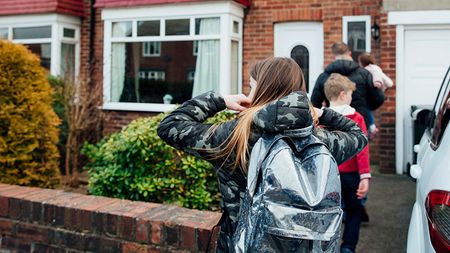 People going into a house © Getty Images/iStockphoto