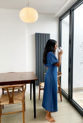 A woman's jean dress outfit with a long maxi denim.