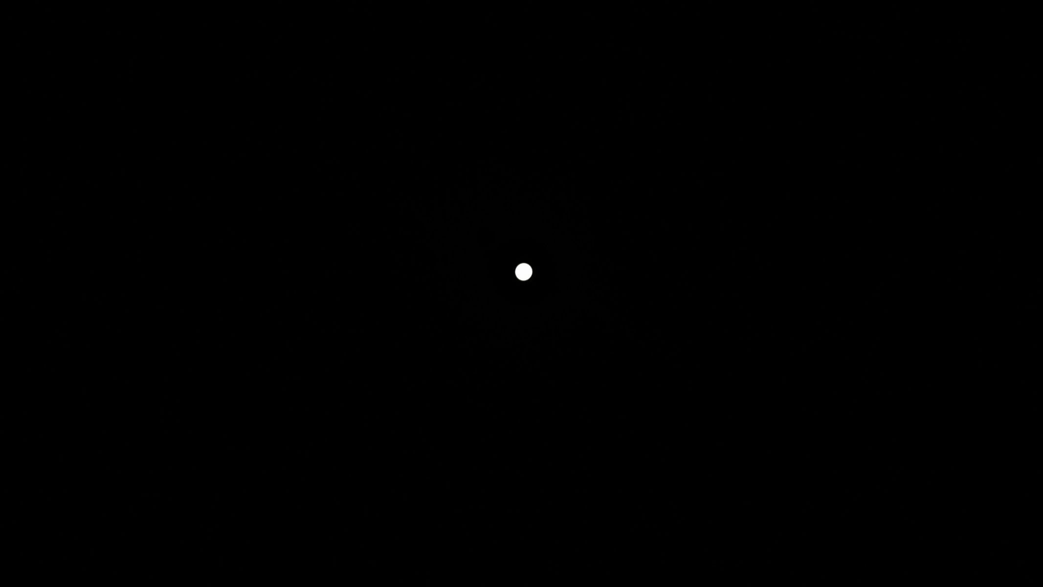 An unzoomed phone image shows the sun&rsquo;s tiny scale