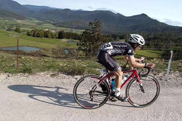 Reuben Donati (McDonagh Blake/Witness) from New South Wales has the climb to himself on a gravel section of the road near Gunns Plains.