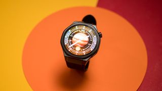 Honor Watch 5 Ultra against colorful background