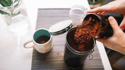 An example of how to store coffee grounds, by storing them in a metal canister