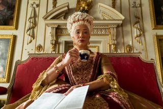Bridgerton Queen Charlotte spin-off - Bridgerton's Queen Charlotte drinking tea on her throne. 