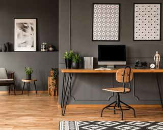 gray home office with wooden desk