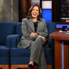 Kamala Harris tapes the Late Show with Stephen Colbert wearing a gray suit and a black top underneath