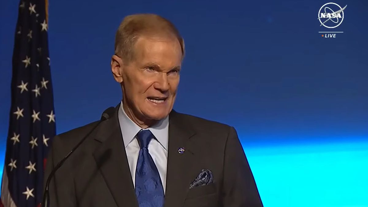 nasa administrator bill nelson speaking in front of an american flag