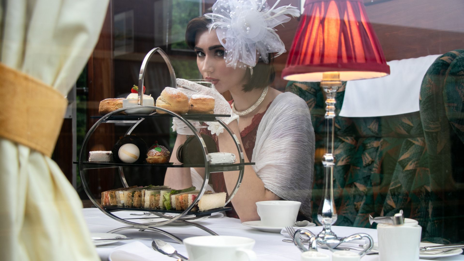A mysterious lady sips her tea