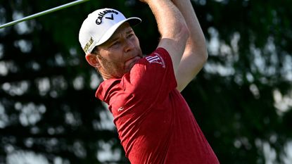 Branden Grace takes a tee shot in the 2022 LIV Golf Invitational Chicago tournament at Rich Harvest Farms