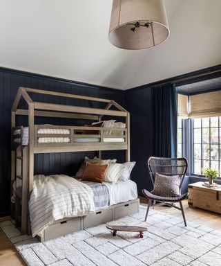 navy childrens bedroom with bunk beds and white and wooden accents