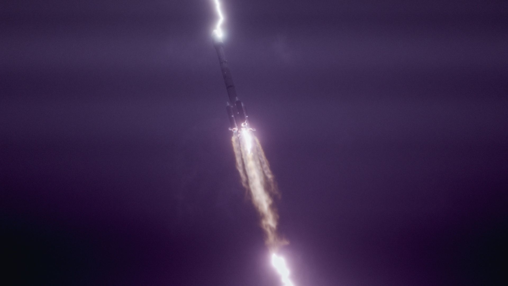 Photo of the rocket in the air with lightning striking the rocket
