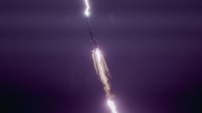 Photo of the rocket in the air with lightning striking the rocket 