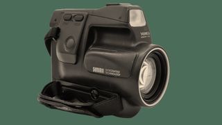 The front of the Kyocera Samurai camera on a green background