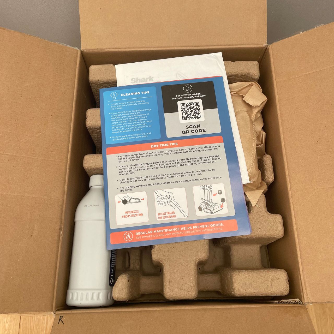 Open box of the Shark CarpetForce Upright Carpet Cleaner, showing the packaging and contents inside