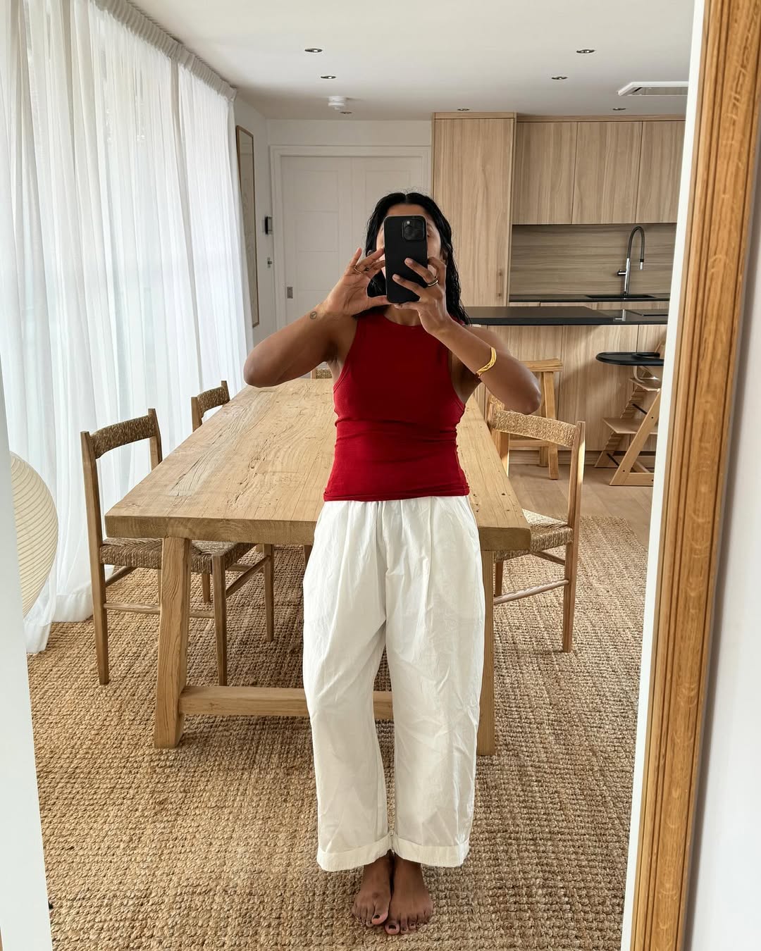 Monikh in white culotte trousers