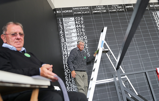 Scores on the doors: the dressage results after day two are hand written on the score board