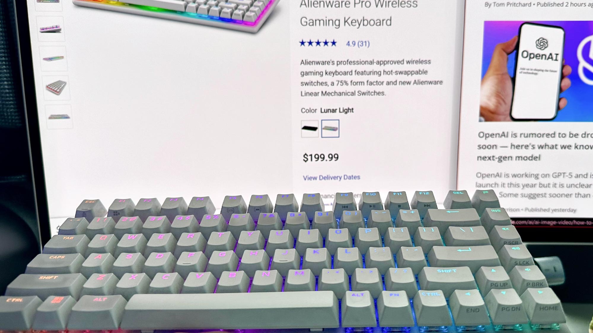 Alienware Pro keyboard in front of a screen of the official Dell product page.