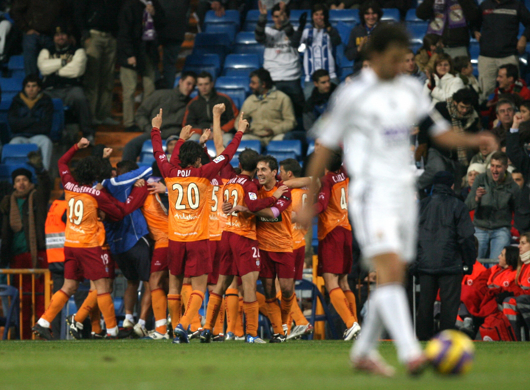 Madrid, SPAIN: Recreativo de Huelva&amp;amp;apos;s players celebrate the third goal during their Liga football match against Real Madrid in Madrid, 20 December 2006. Recreativo de Huelva won 0-3. AFP PHOTO/ PIERRE-PHILIPPE MARCOU (Photo credit should read PIERRE-PHILIPPE MARCOU/AFP via Getty Images)