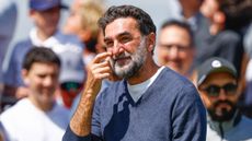 Yasir Al-Rumayyan scratches his cheek during the LIV Golf Team Championship 2025