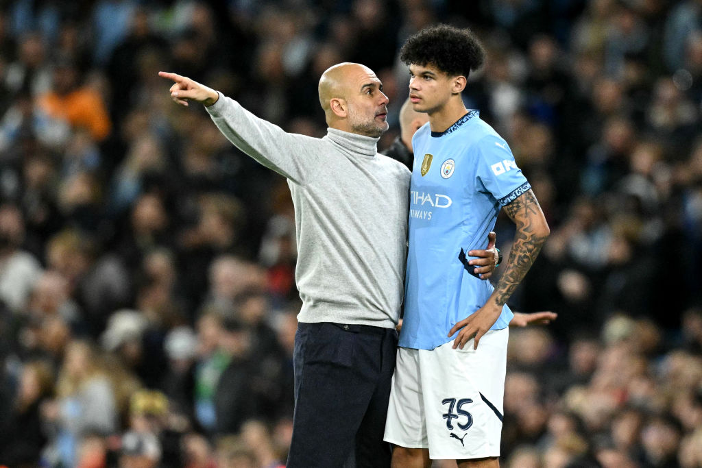 TOPSHOT - Manchester City's Spanish manager Pep Guardiola talks to Manchester City's English midfielder #75 Nico O'Reilly during the UEFA Champions League football match between Manchester City and Sparta Prague at the Etihad Stadium in Manchester, north west England, on October 23, 2024. (Photo by Oli SCARFF / AFP) (Photo by OLI SCARFF/AFP via Getty Images) Chelsea target