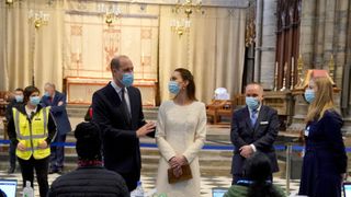 LONDON, ENGLAND - MARCH 23: Prince William, Duke of Cambridge and Catherine, Duchess of Cambridge speak with staff during a visit to the Covid-19 vaccination centre at Westminster Abbey on March 23, 2021 in London, England. (Photo by Aaron Chown - WPA Pool/Getty Images)