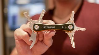 KeySmart iPro smart key tracker held in hand.