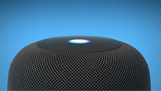 a close up of the apple homepod smart speaker against a blue background
