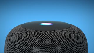 Dessus du Apple HomePod sur fond bleu