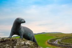 The Gavin Maxwell Memorial, Sculpted by Penny Wheatley, at Monreith, Dumfries and Galloway, Scotland. Credit: Alamy