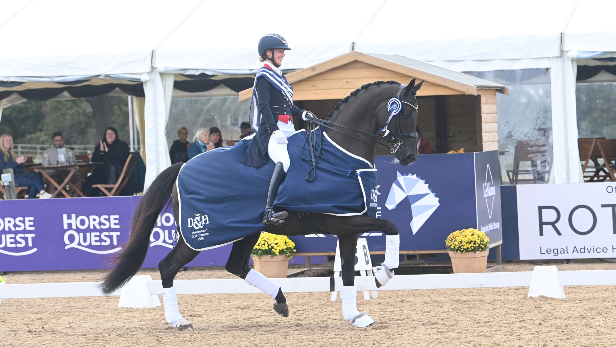Laura Tomlinson rides Ostmarks Digal during the prize-giving at the LeMieux National Dressage Championships.