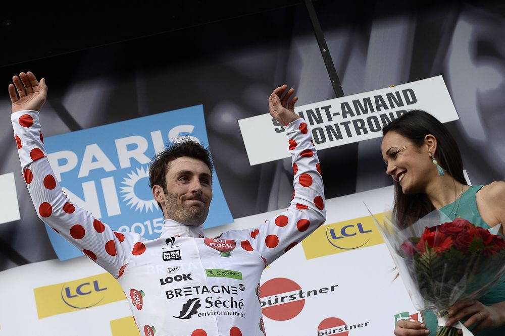 France's Jonathan Hivert celebrates his best climber's polka dot jersey on the podium.