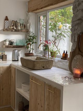 Tiled countertop in a white kitchen