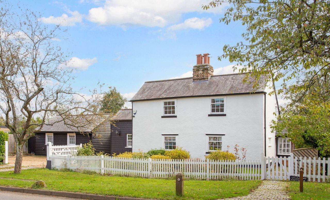 The white exterior of Lilac Cottage