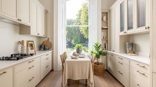 cream kitchen with window and table