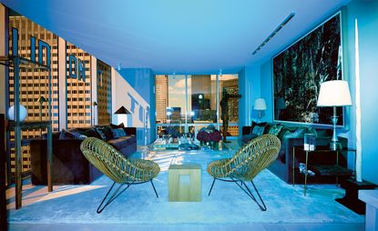 Living room with sofas, chairs and view of the city out of the window