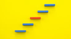 Five blue and red steps against a yellow background.