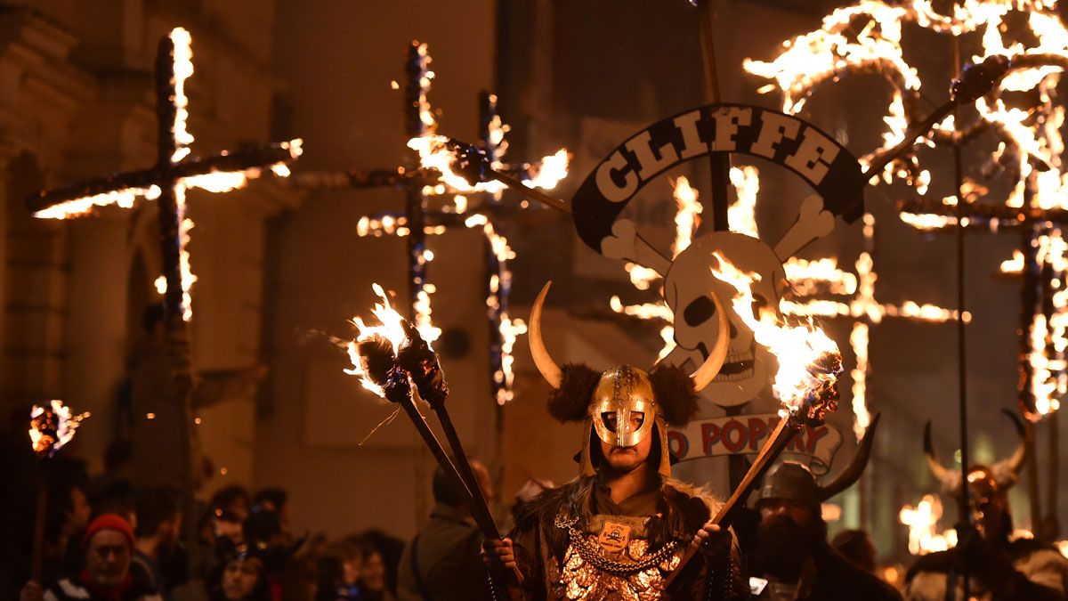 A member of the Cliffe Bonfire Society, one of seven who organise the celebrations, marches with the society's banner