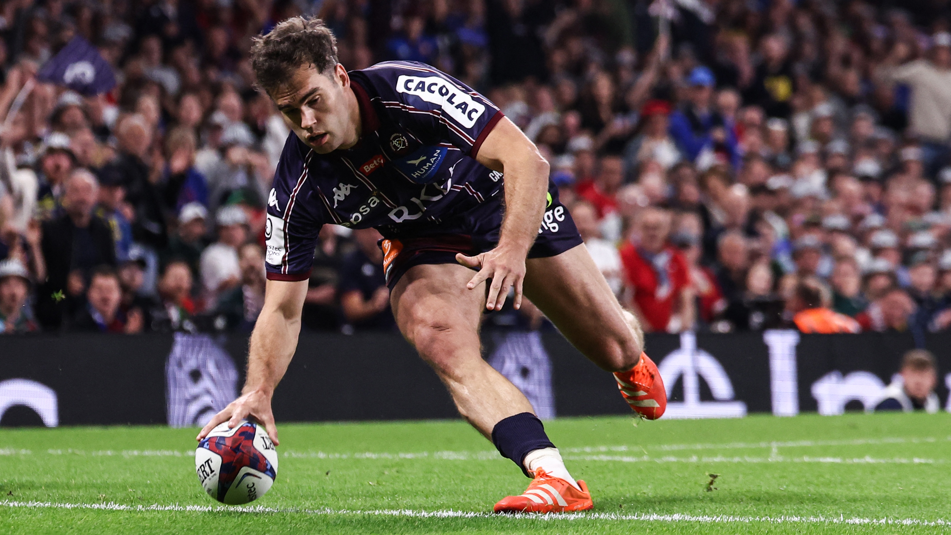 Bordeaux-Begles&#039; French wing Damian Penaud scores a try during the Champions Cup Final rugby union match between Northampton Saints and Bordeaux-Begles at the Principality Stadium in Cardiff, south Wales, on May 24, 2025. 