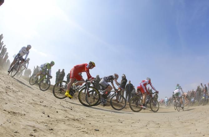 The peloton speed past in the 2013 Paris-Roubaix