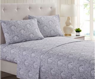 Mellanni Queen Sheet Set on a gray bed frame against white walls.