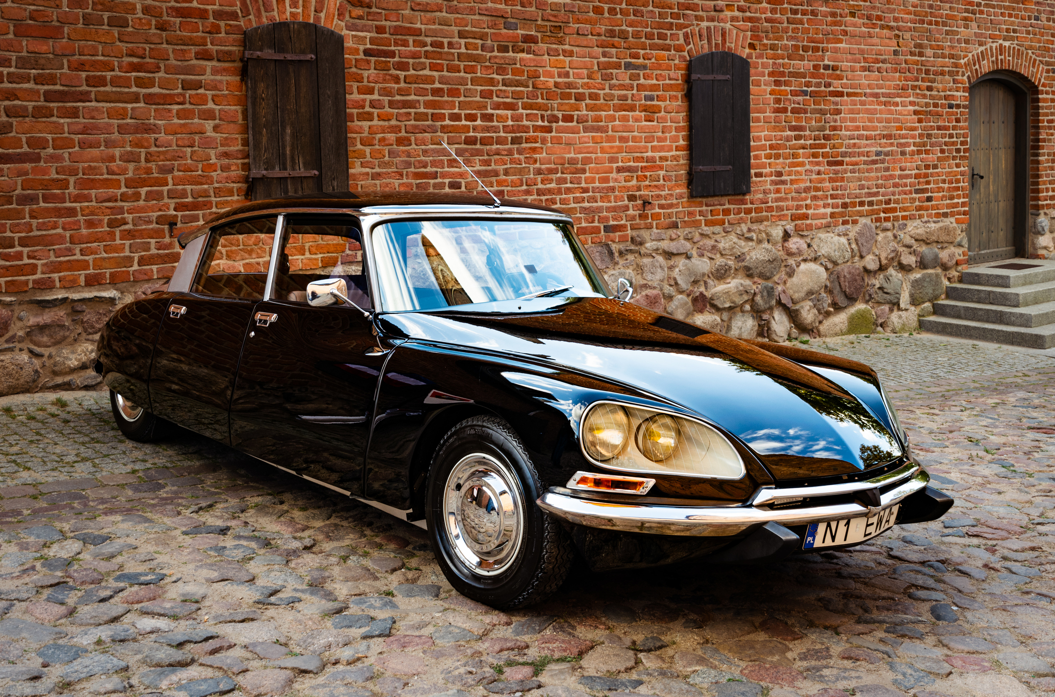 Beautiful classic car Citroen DS on the street with historic architecture