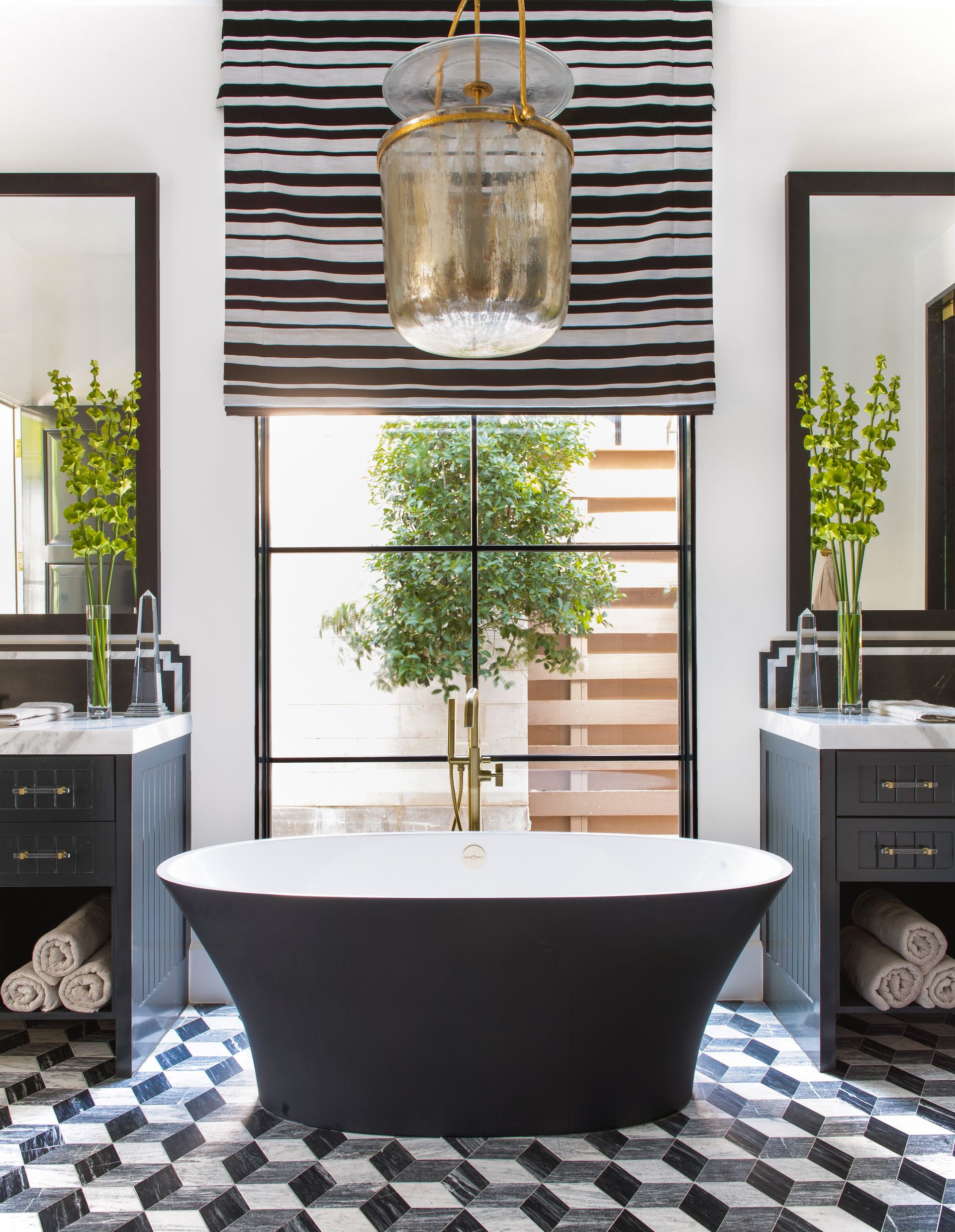 black bath in monochrome bathroom