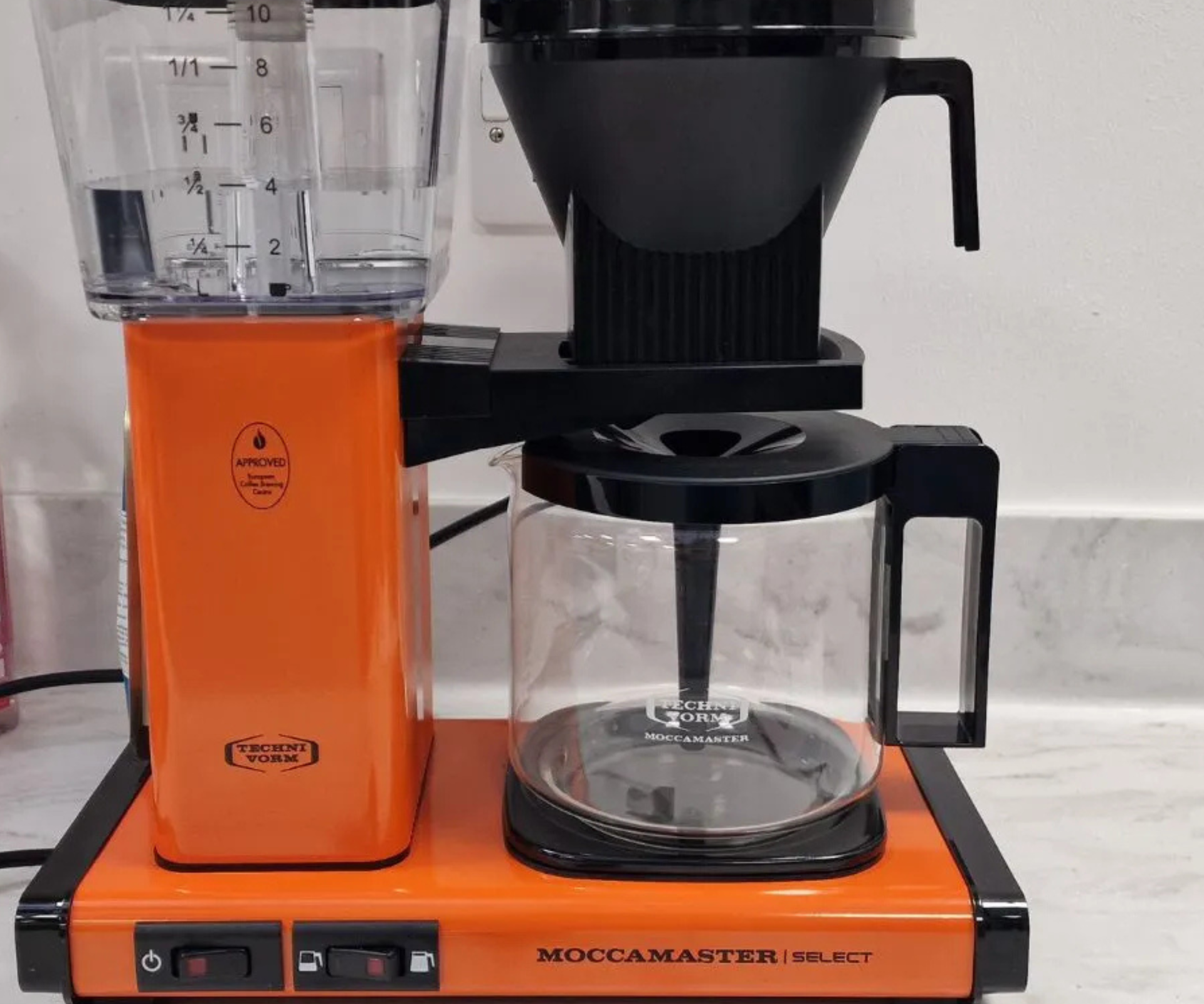 A bright orange Technivorm Moccamaster in the test kitchen