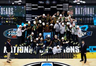 The Baylor Bears pose with the National Championship trophy after winning the National Championship game of the 2021 NCAA Men's Basketball Tournament against the Gonzaga Bulldogs at Lucas Oil Stadium on April 05, 2021 in Indianapolis, Indiana. The Baylor Bears defeated the Gonzaga Bulldogs 86-70.