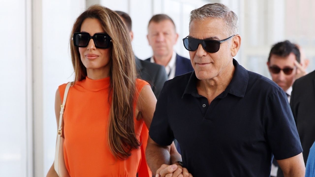 Amal Clooney departs the 81st Venice Film Festival with husband George Clooney.