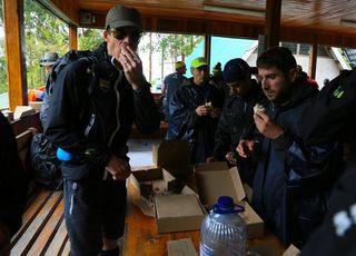Alberto Contador and his teammates take in the necessary nourishment