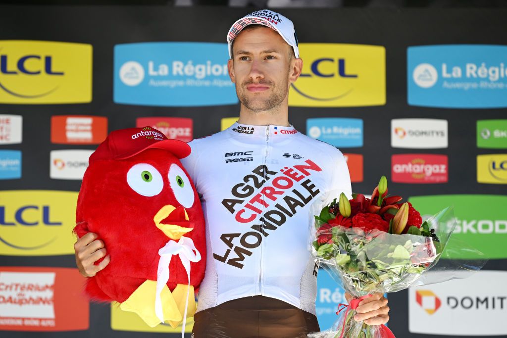 GAP FRANCE JUNE 10 Geoffrey Bouchard of France and AG2R Citren Team celebrates winning the trophy for the most combative rider on the podium ceremony after the 74th Criterium du Dauphine 2022 Stage 6 a 1964km stage from Rives to Gap 742m WorldTour Dauphin on June 10 2022 in Gap France Photo by Dario BelingheriGetty Images